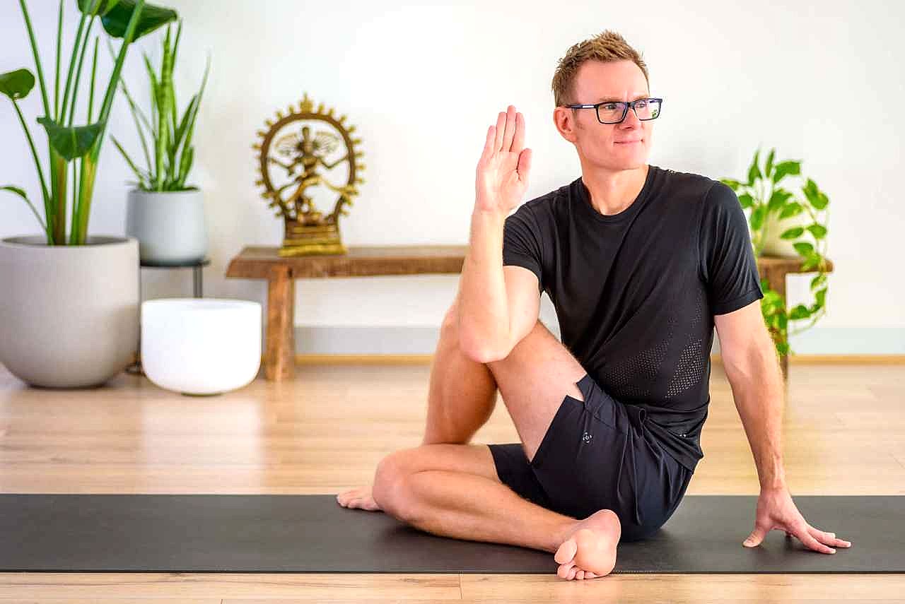 A male performing a yoga pose
